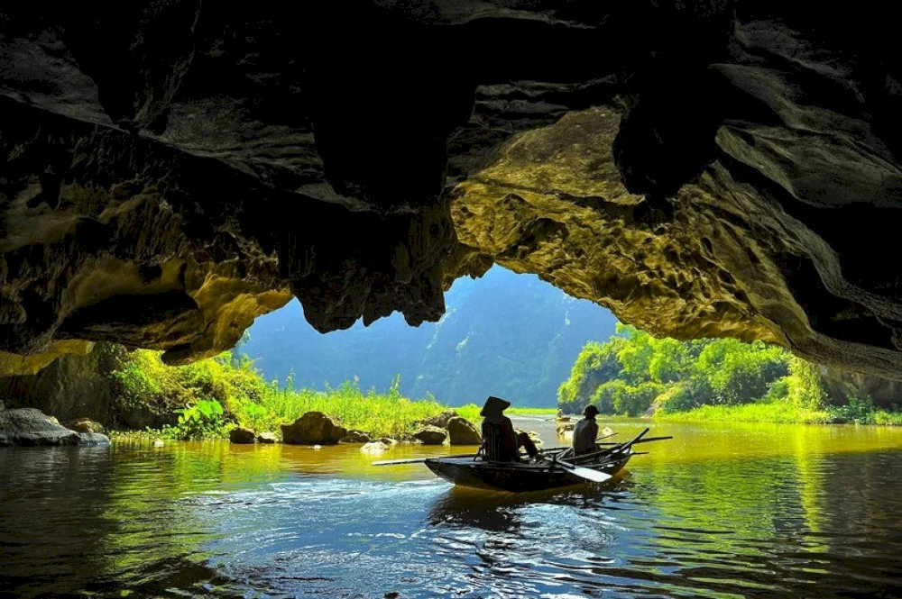 The boat ride through these caves is the perfect way to experience Tam Coc’s tranquil beauty